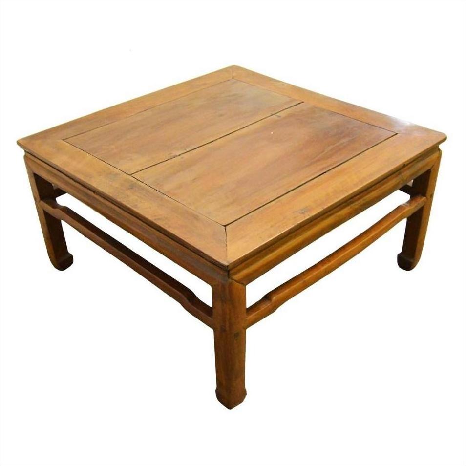 Light brown elm wood coffee table with simple design and sturdy legs, shown against a plain white background.