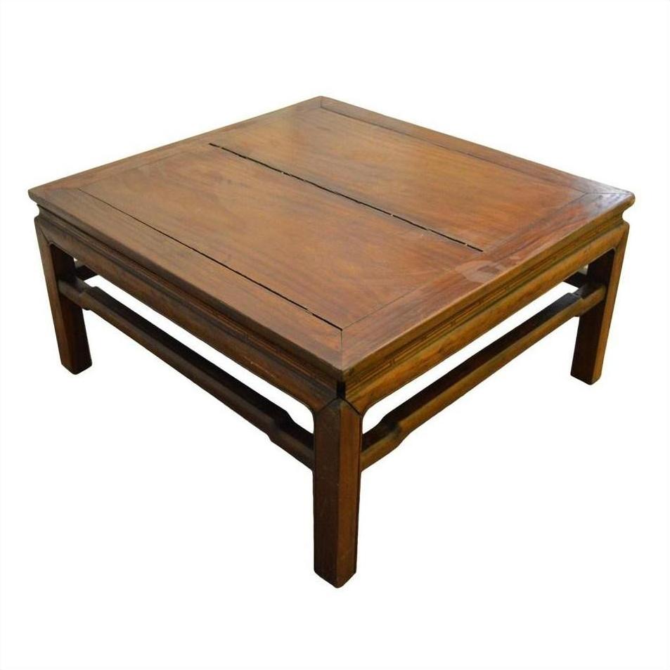 Brown Yumu wood coffee table with simple design and visible grain on a white background.