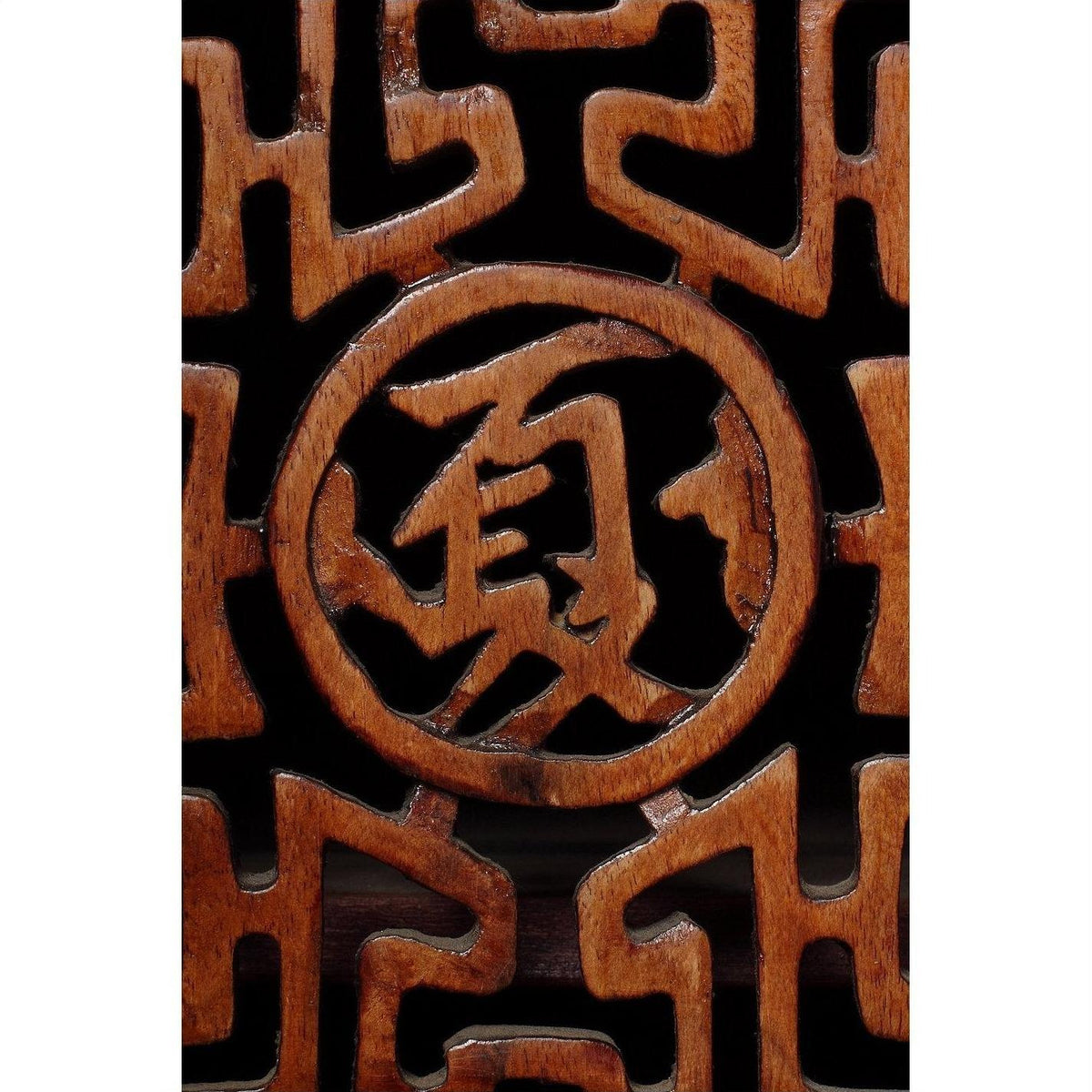 Close-up of dark wood Chinese cabinet with carved fretwork doors and visible Chinese character detail.