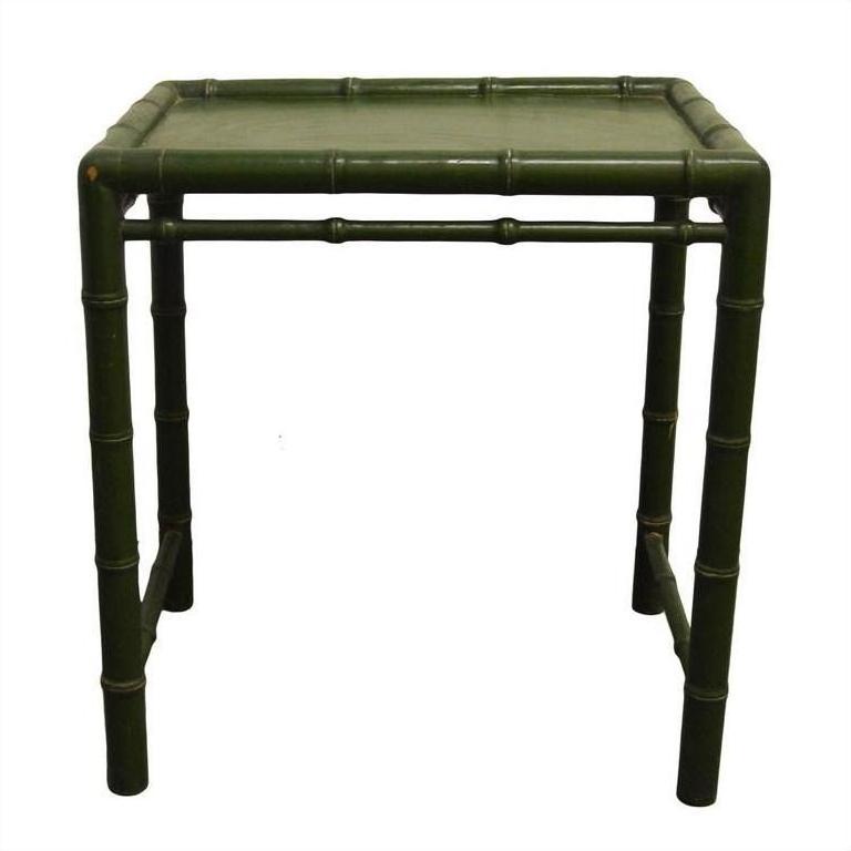 Green bamboo-style side table with square top, natural look, close-up of legs and edges.