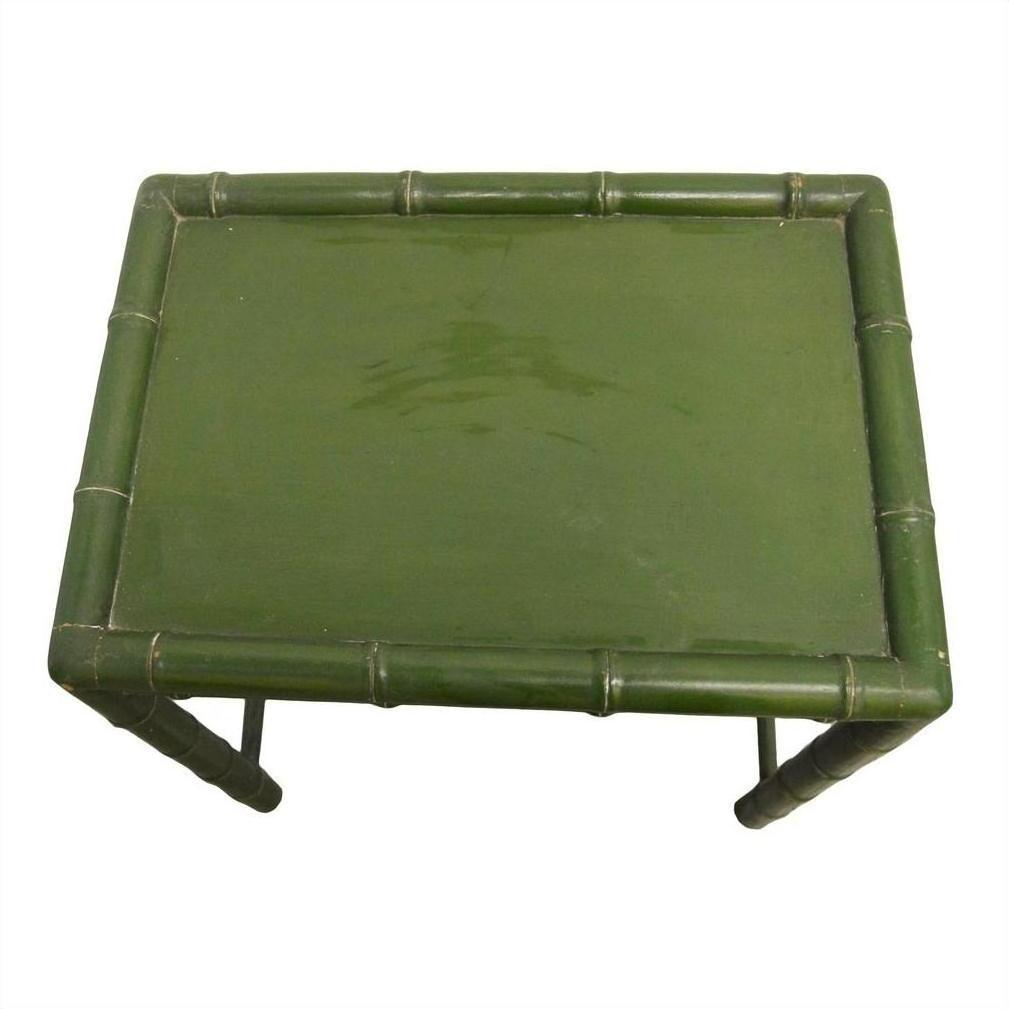 Green bamboo side table with rectangular top and bamboo-style legs on white background.