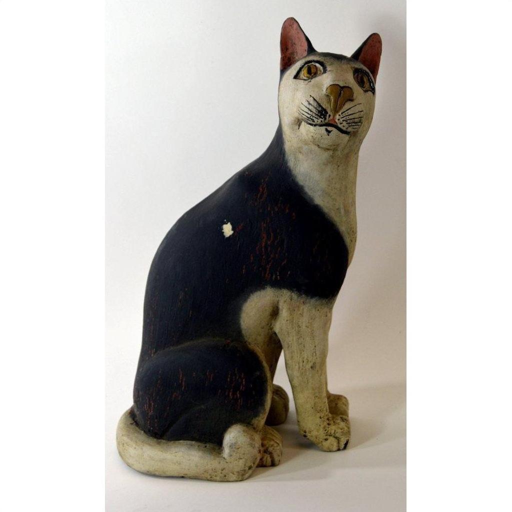Black and white painted ceramic cat figurine in good vintage condition, close-up.