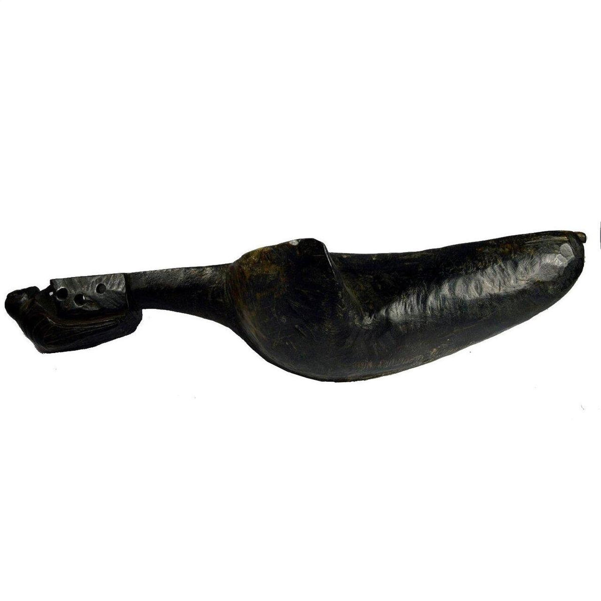 Close-up of dark prosthetic leg with foot shaped like a hand-carved Indian Saringda lute, amputee style.