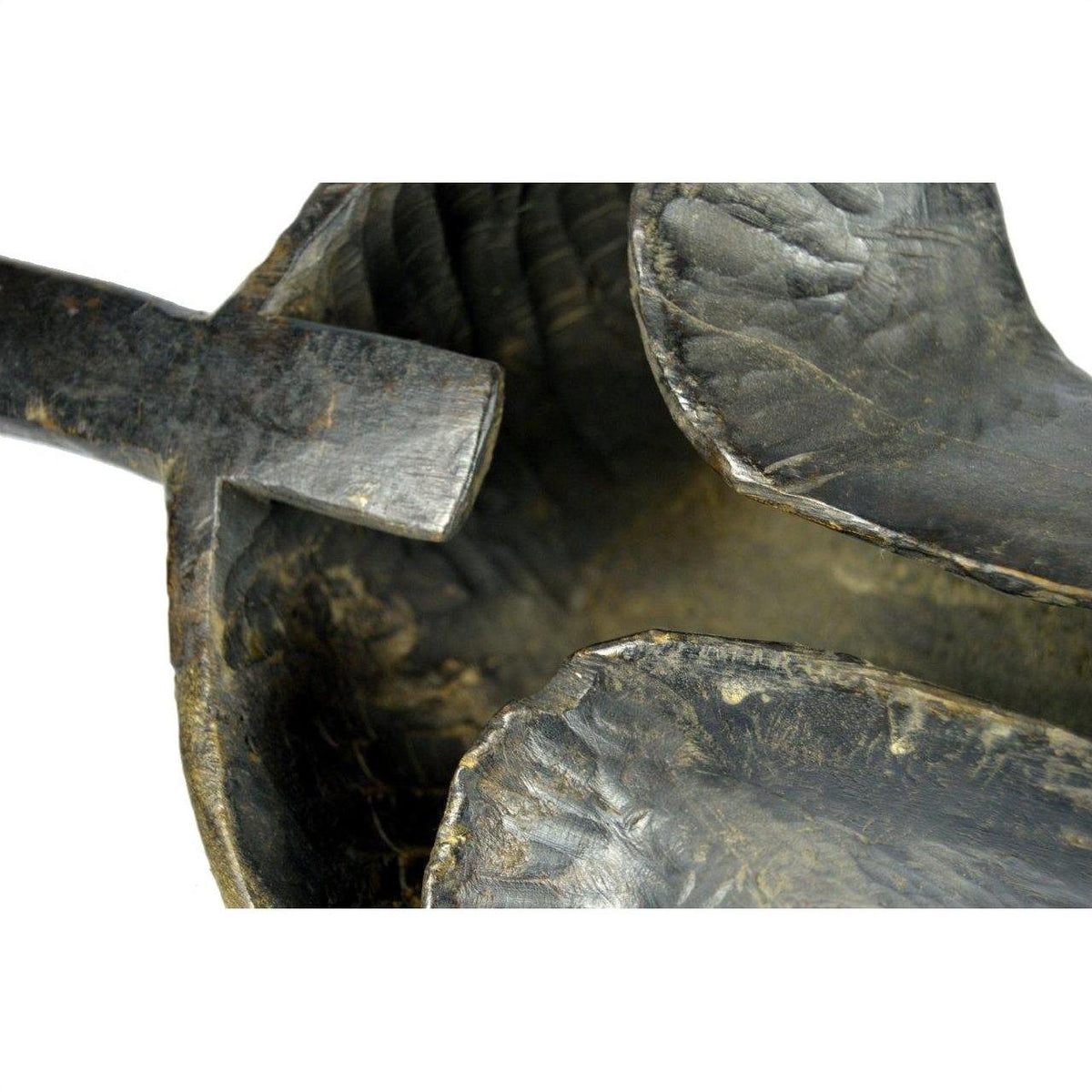 Close-up of brown wood carved Saringda lute with curved bowl and handle, indoors.