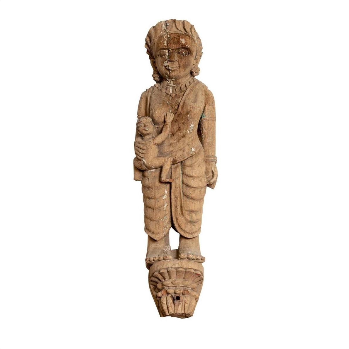 Brown hand-carved wood statue of mother and child in draped clothing, inspired by Indian temples, Gujarat style.