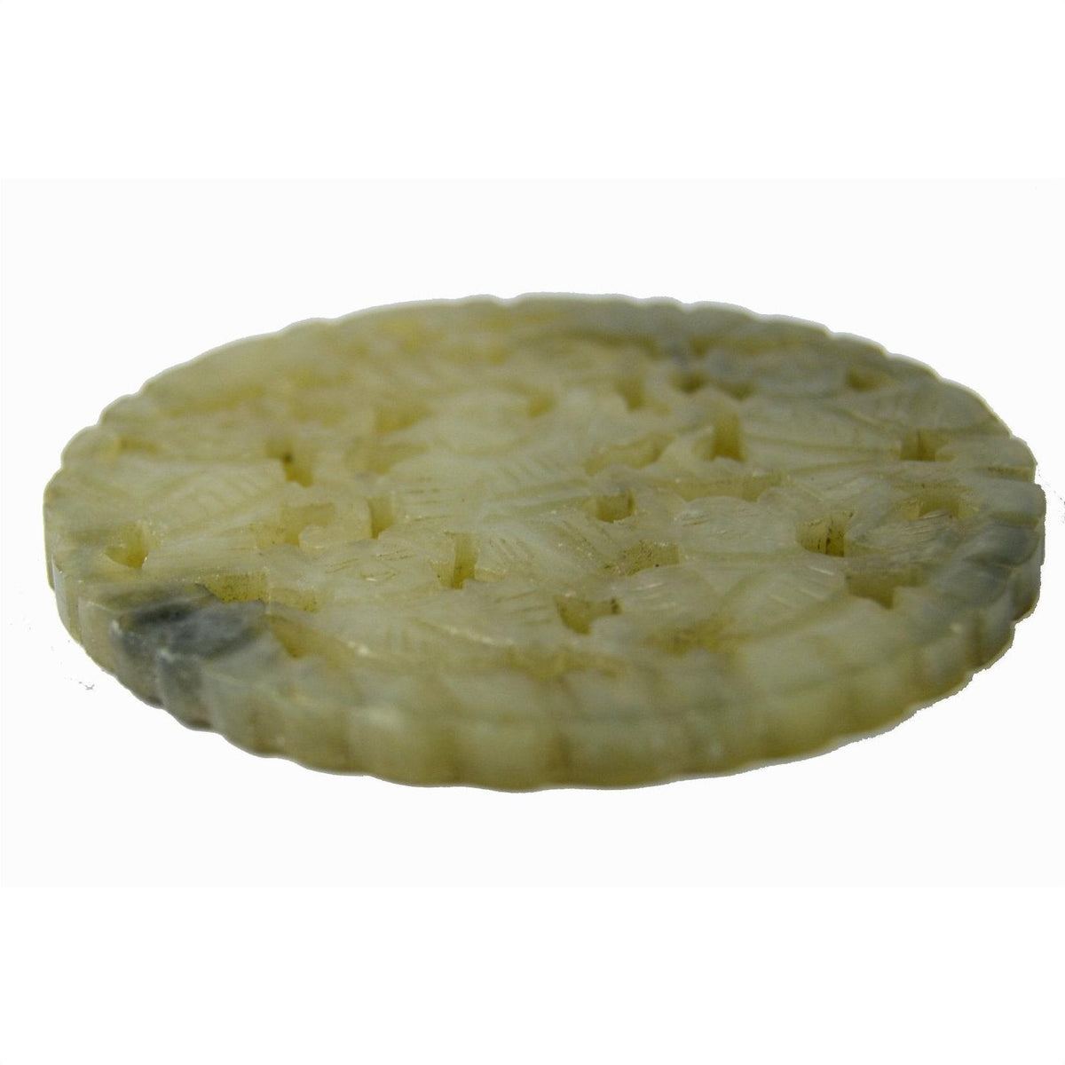 Close-up of round pale jade medallion with hand-carved floral design, 2 1/8" diameter, in very good condition.