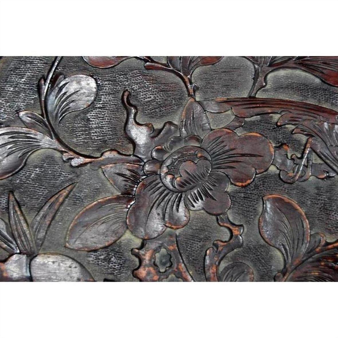 Dark rosewood wall plaque, hand-carved and lacquered, with bird motif, inspired by 19th-century Chinese decor.
