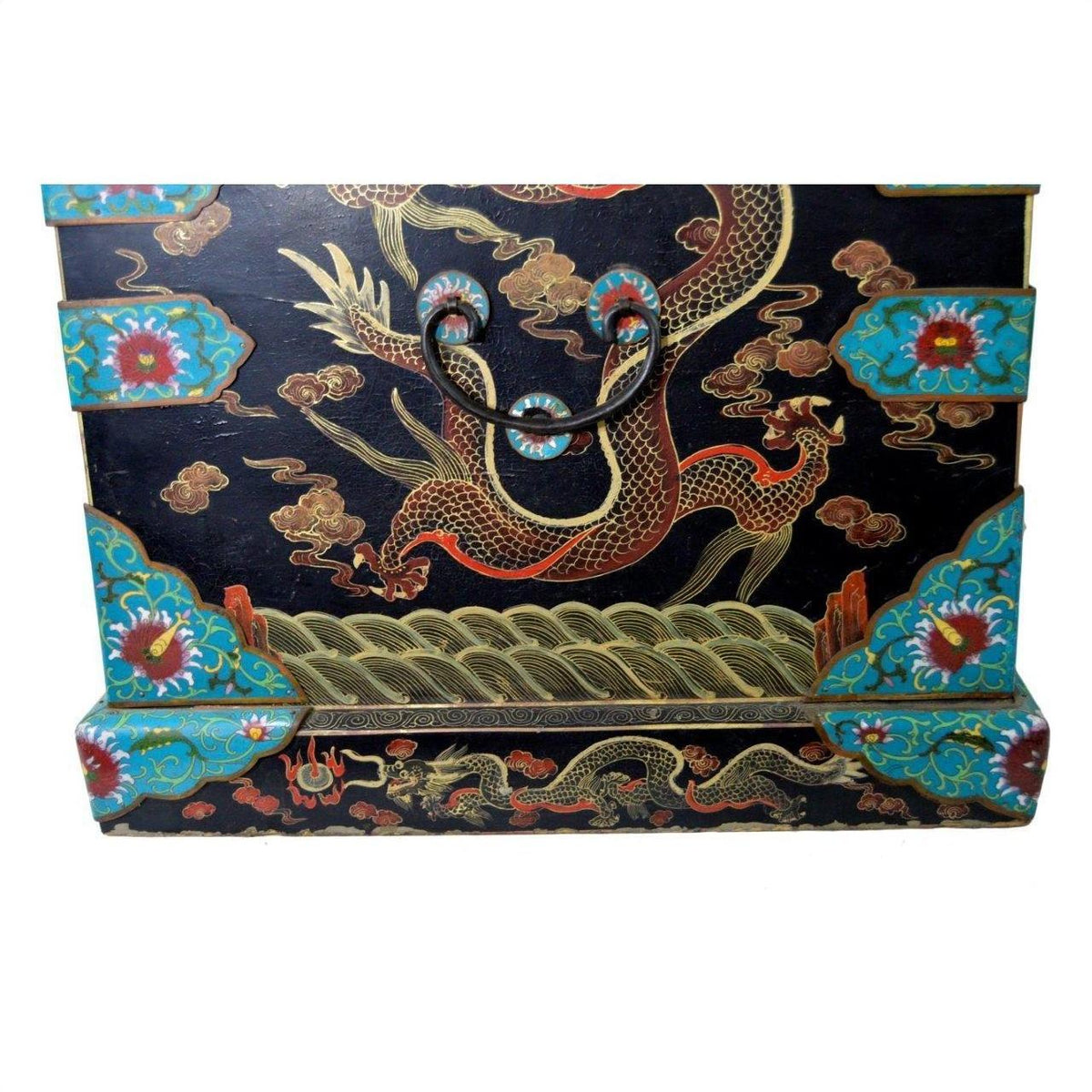 Black lacquer hand painted dowry box with gold dragon and colorful floral designs, close-up view.