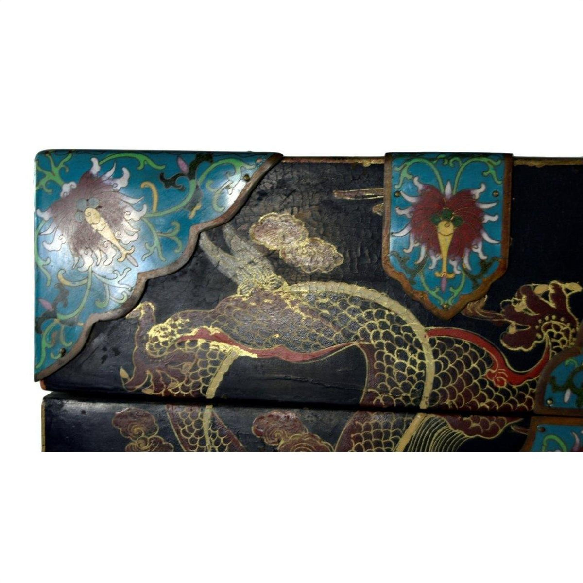 Black wooden dowry box with hand-painted gold dragons and teal floral panels, close-up view.