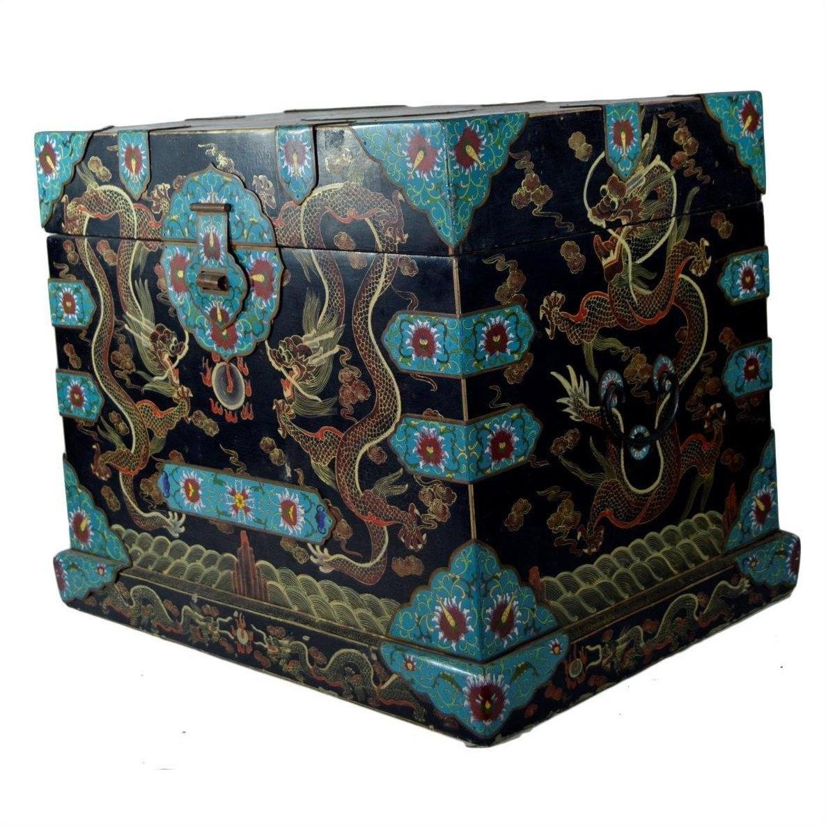 Black lacquer wooden dowry box with hand painted gold dragons, floral designs, and blue accents, close-up view.