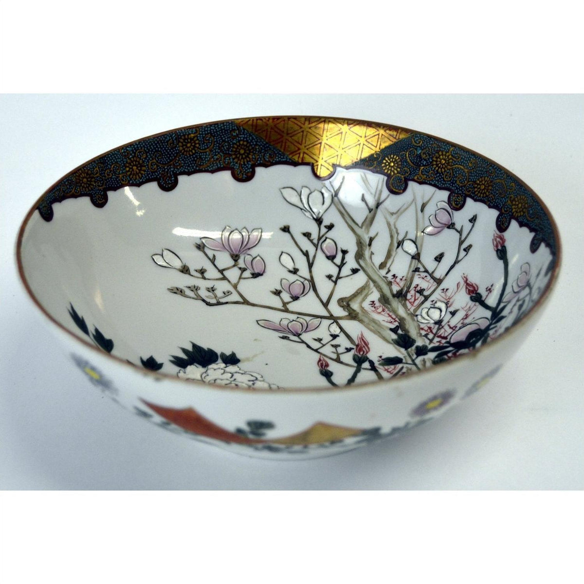 White porcelain Kutani bowl with gold trim, hand painted pink flowers and blooming branches, 7 inch diameter.