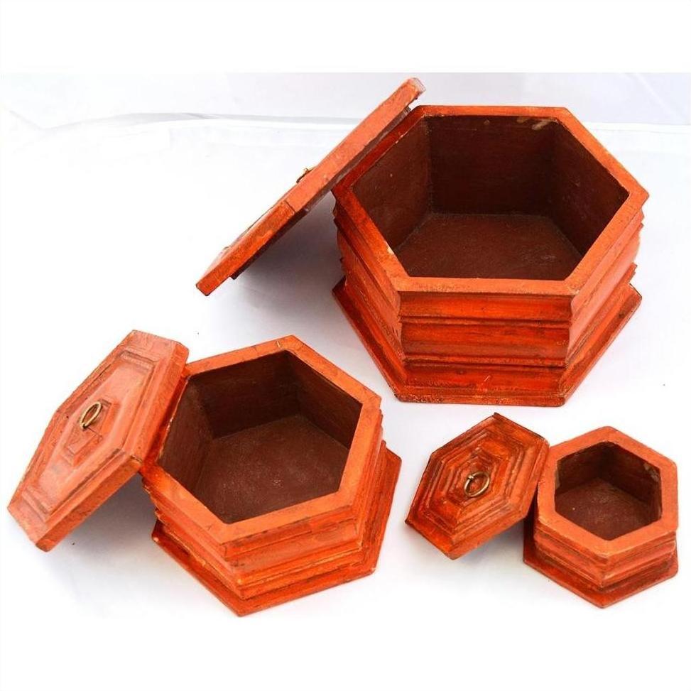 Hand-painted vintage octagonal boxes with lids, nested together, set on a white background.