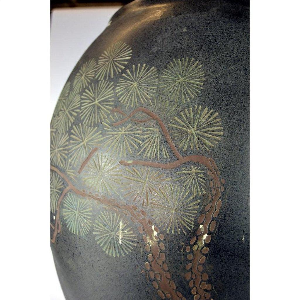 Close-up of a gold and brown ceramic vase with abstract tree design and light paint loss, hand painted in Hong Kong.