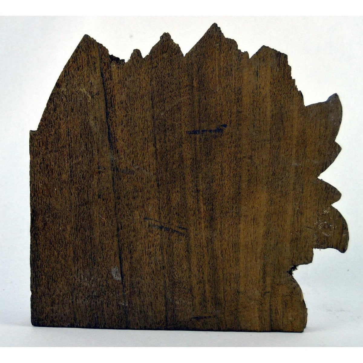 Brown wood hand-carved temple plaque with jagged edges in lion's head shape, close-up, 9.5" x 8.5" x 1".