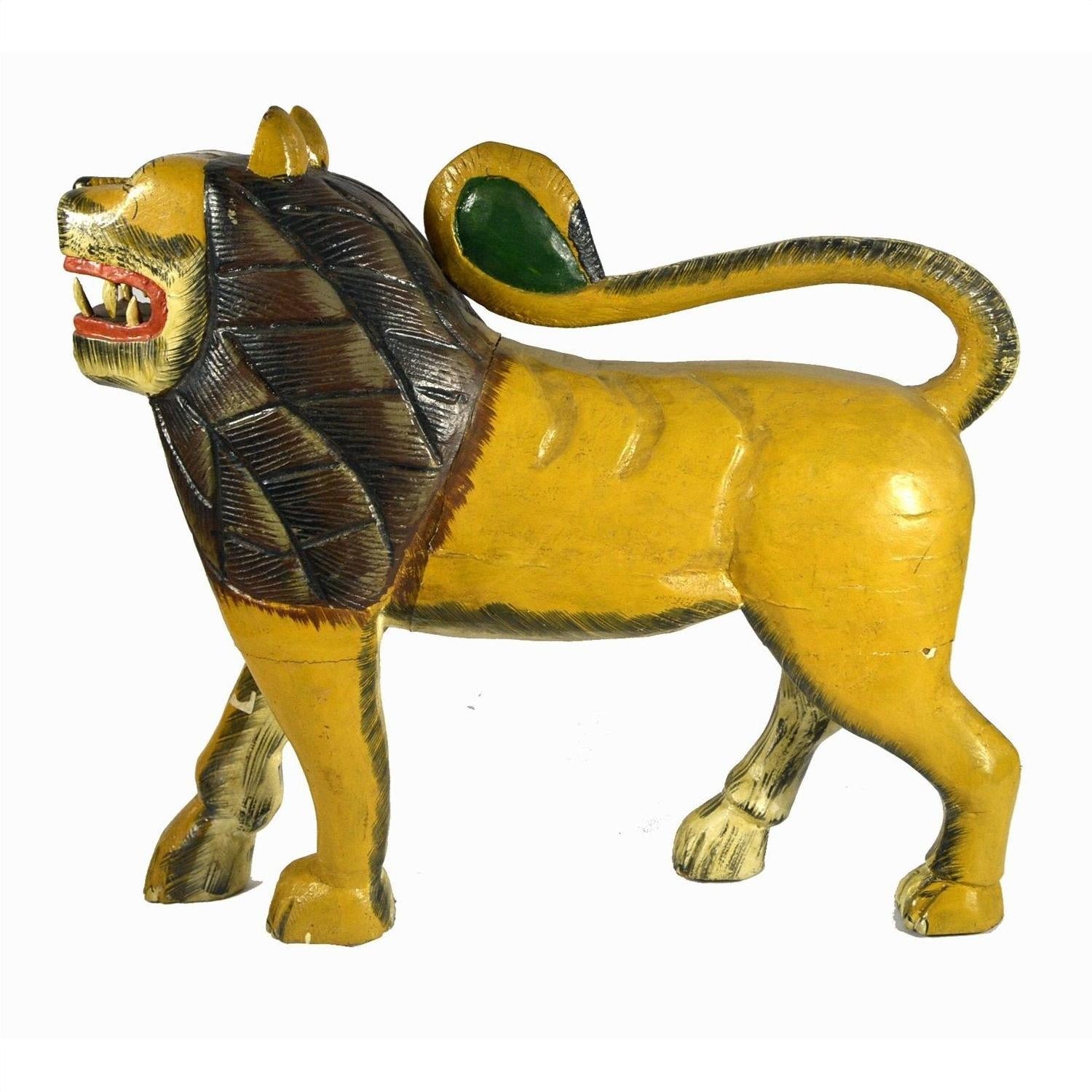 Yellow and brown hand carved wooden lion with open mouth and curled tail, 18"L x 16.5" x 4.5", close-up, good condition.