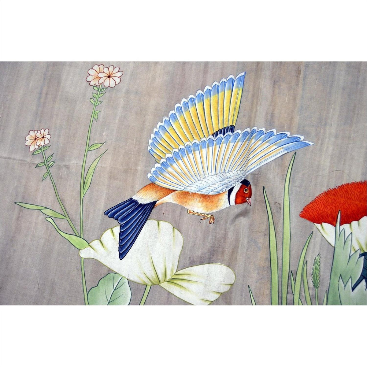 Colorful silk tapestry with blue and yellow bird flying among flowers and green leaves, 46 x 35 inches, used.