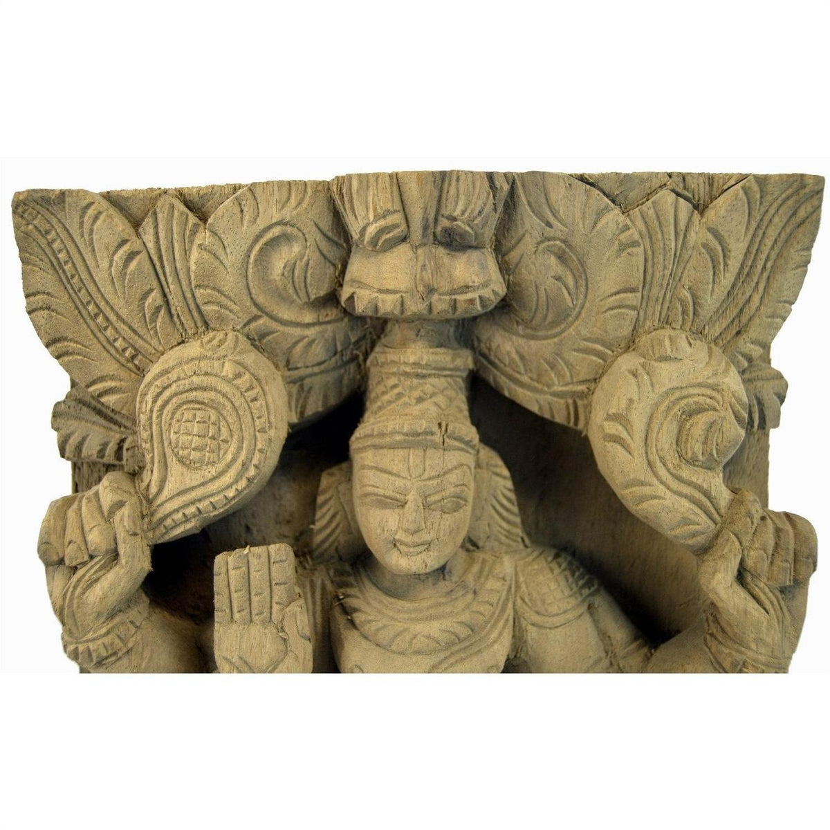 Brown sheesham wood carving of deity with intricate headdress, two raised hands, India temple style, close-up view.