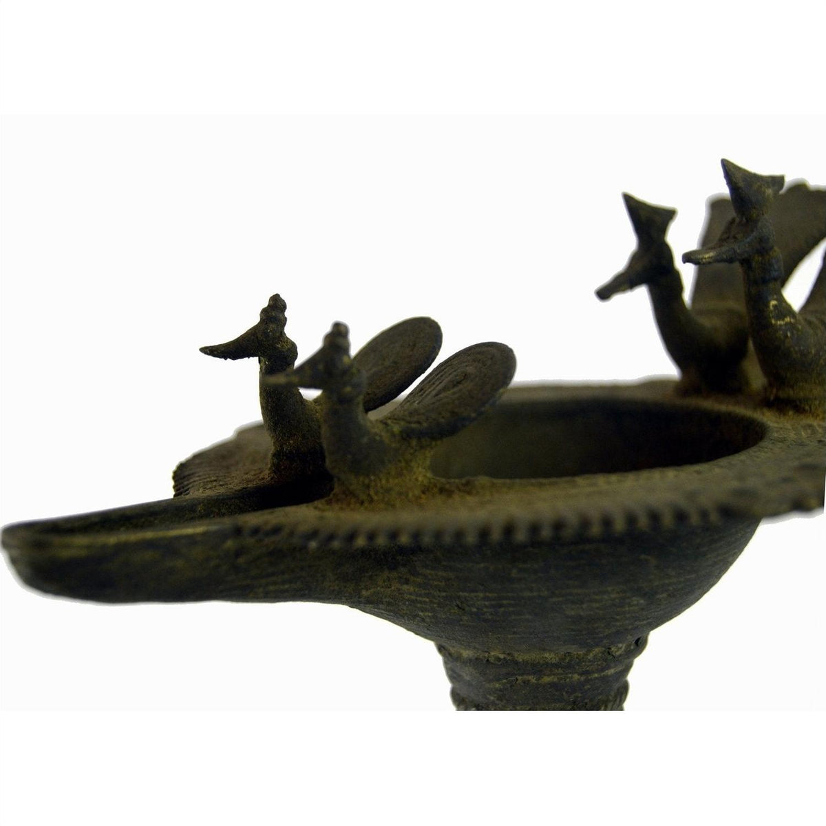 Close-up of brass Indian oil burner with bird-shaped decorations, 5 1/4" diameter, on white background.