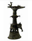 Brass Indian oil burner with intricate detailing, used as a collectible or decorative vase, close-up view.