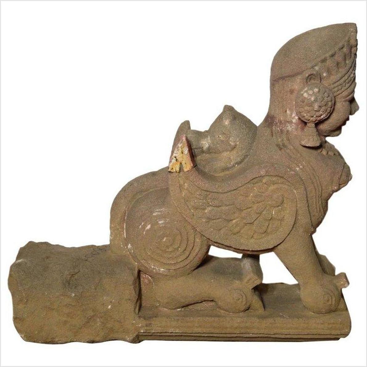 Side view of a gray stone Indian sphinx sculpture from the 19th century with tiara and earrings, hand-carved.