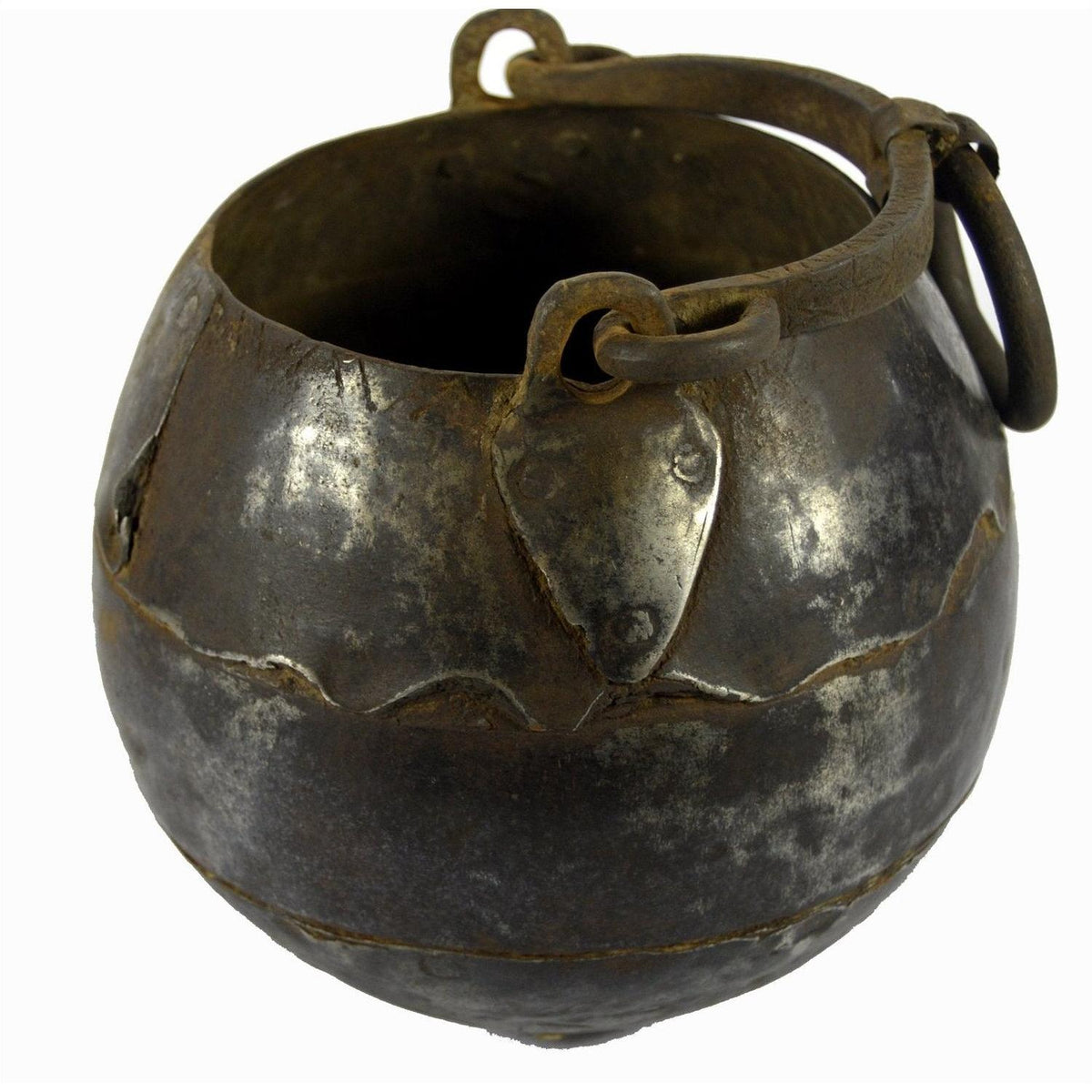 Close-up of a rustic iron Indian water jug with handle, vintage style, used as vase for home decor.