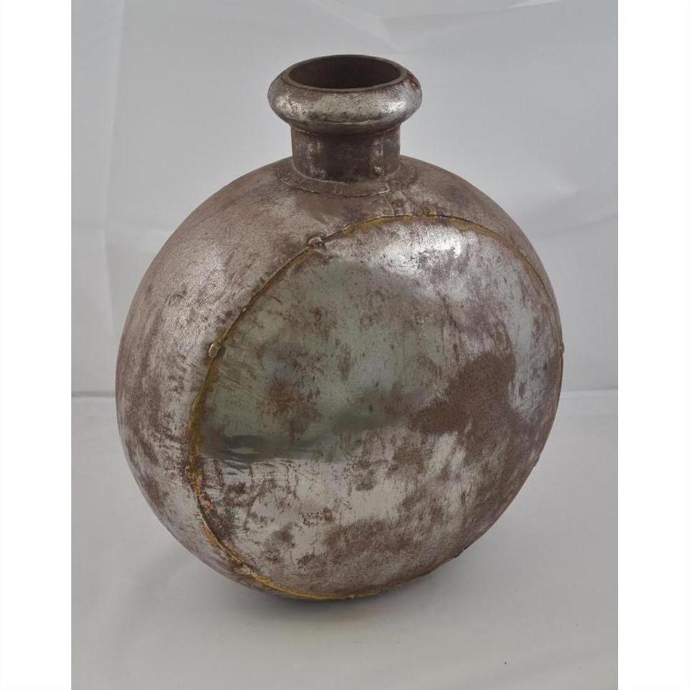 Silver metal Indian water jug with oval shape, short neck, and visible weld marks on plain background.