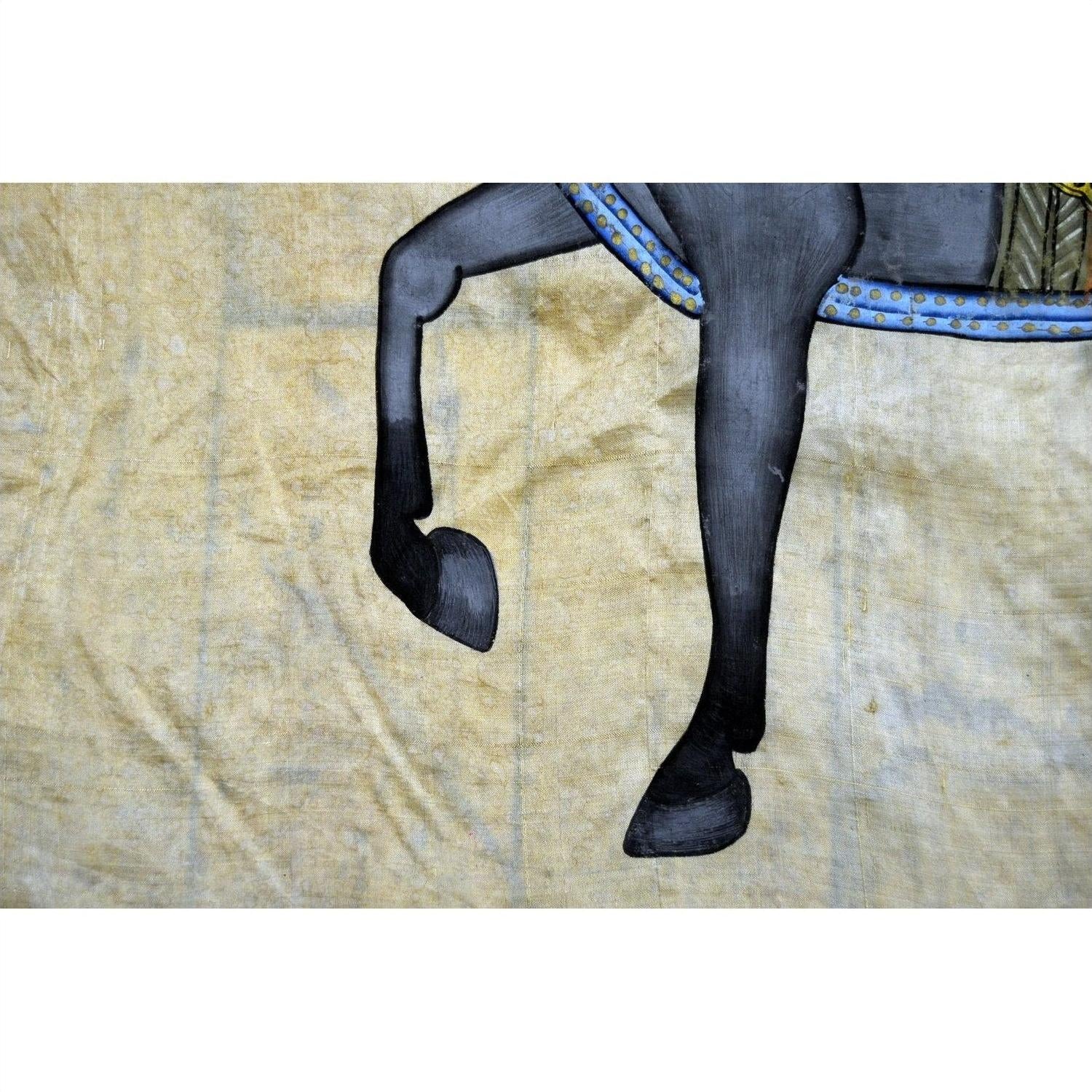 Black fabric tapestry with horse legs, hooves, and saddle detail visible; shows used condition; 33.5" x 22.5.