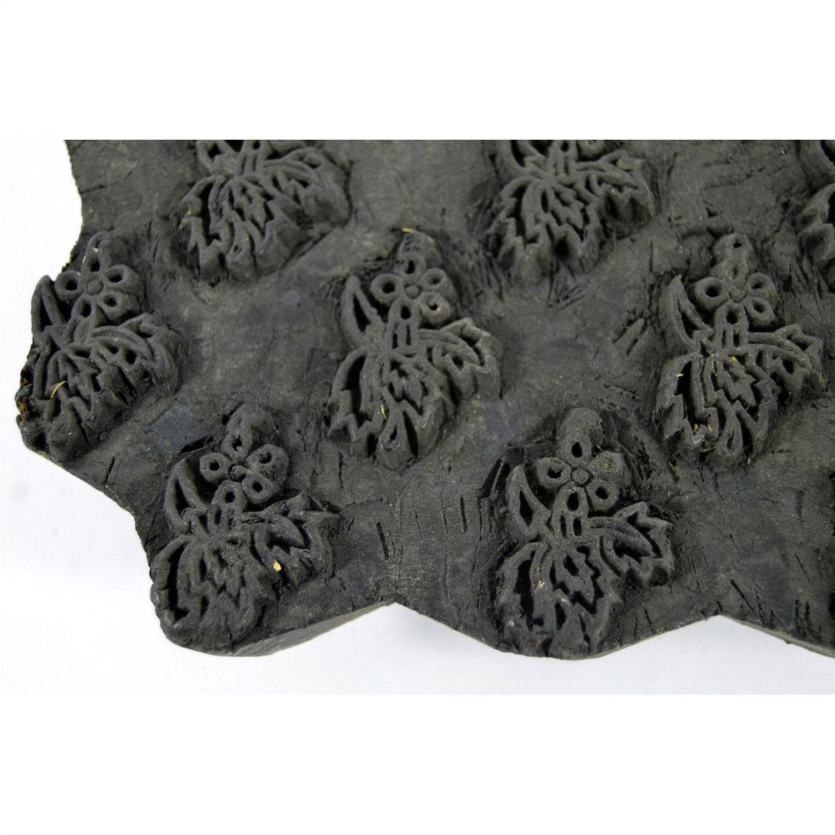 Close-up of brown wooden Indian ink block with repeating floral pattern, 7-inch size, in good condition.