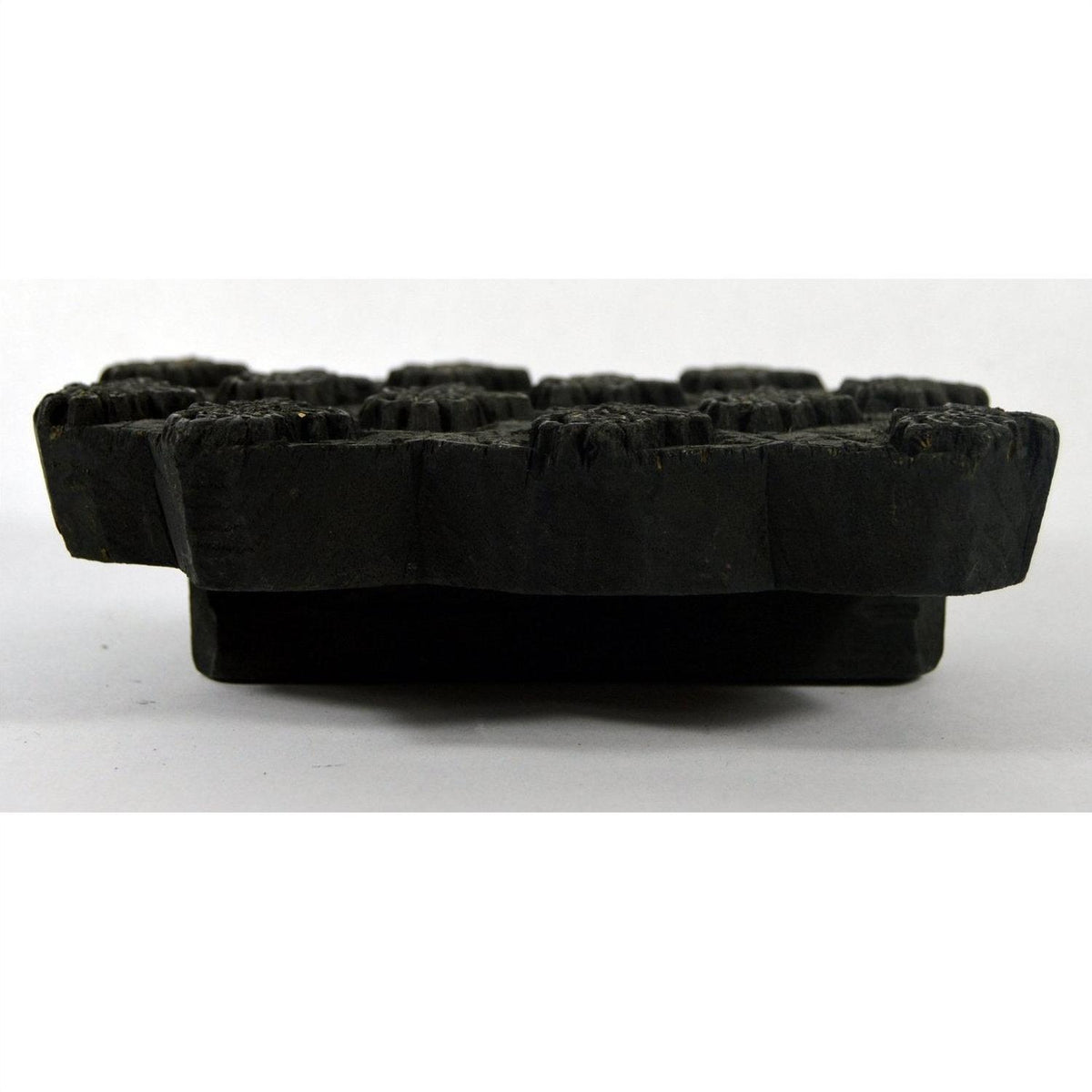 Close-up of a large dark wooden ink block with flat ridges, shown inside a 7-inch box on a white background.