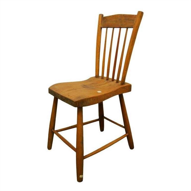 Brown wooden Indonesian chair with slatted backrest and four legs, photographed against a plain white background.