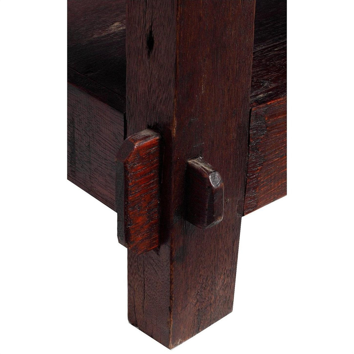 Close-up of natural stain wood Indonesian coffee table showing two beams joined with a mortise and tenon joint.