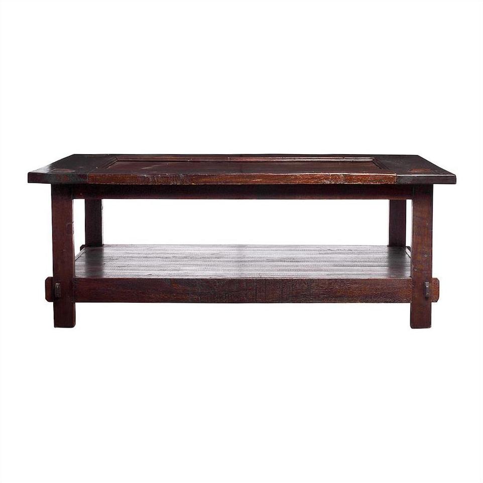 Natural stain wood Indonesian coffee table with rectangular top and lower shelf against plain white background.