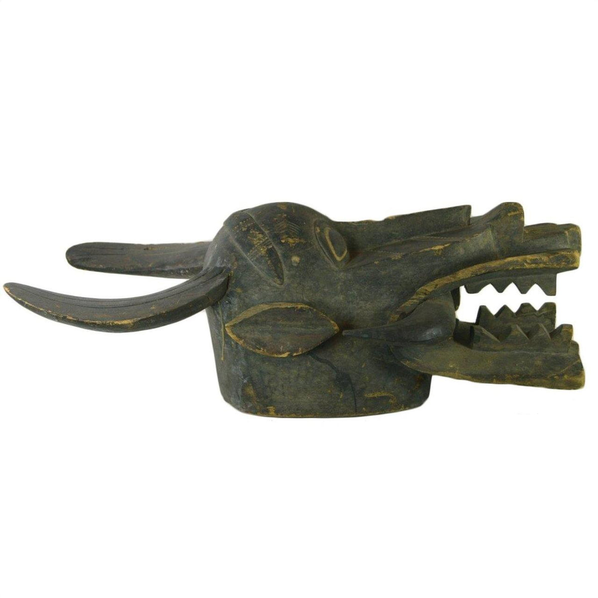 Dark wood hand-carved Indonesian figural shield with long horns, pointed ears, open mouth, visible cracks and repairs.