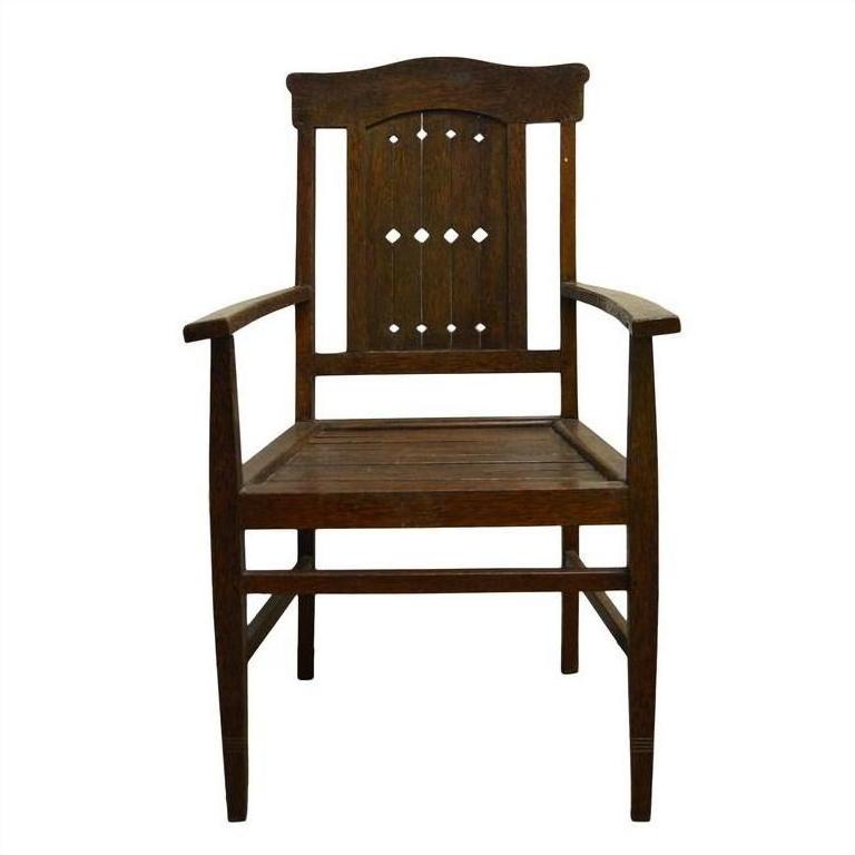 Brown wooden Indonesian Java chair with diamond cut-out backrest, shown on a white background.