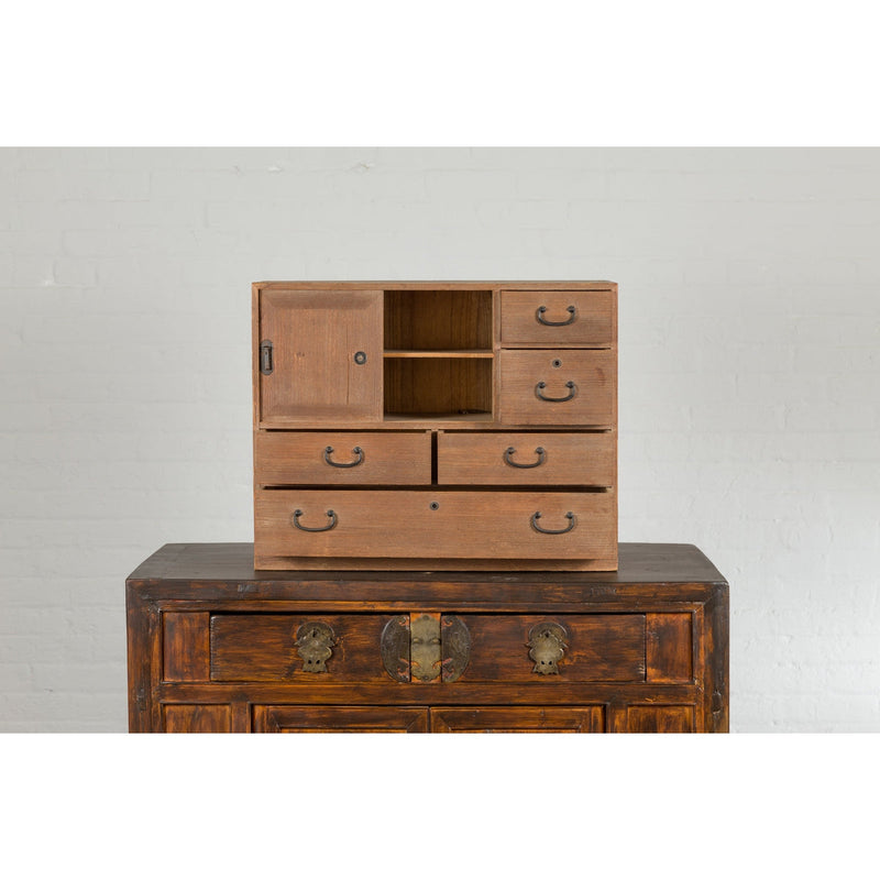 This-is-a-picture-of-a-Japanese Antique Kiri Wood Miniature Tansu Chest with Sliding Doors and Drawers-image-position-3-style-YN7731-Shop-for-Vintage-and-Antique-Asian-and-Chinese-Furniture-for-sale-at-FEA Home-NYC