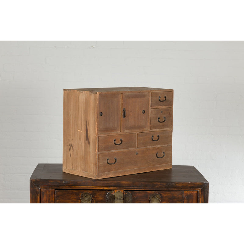 This-is-a-picture-of-a-Japanese Antique Kiri Wood Miniature Tansu Chest with Sliding Doors and Drawers-image-position-5-style-YN7731-Shop-for-Vintage-and-Antique-Asian-and-Chinese-Furniture-for-sale-at-FEA Home-NYC