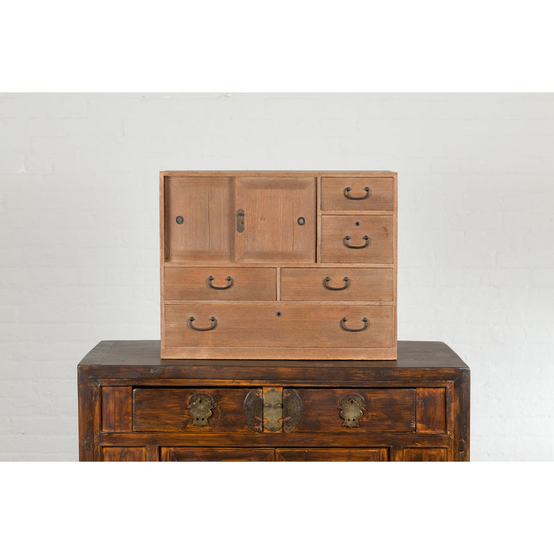 This-is-a-picture-of-a-Japanese Antique Kiri Wood Miniature Tansu Chest with Sliding Doors and Drawers-image-position-6-style-YN7731-Shop-for-Vintage-and-Antique-Asian-and-Chinese-Furniture-for-sale-at-FEA Home-NYC