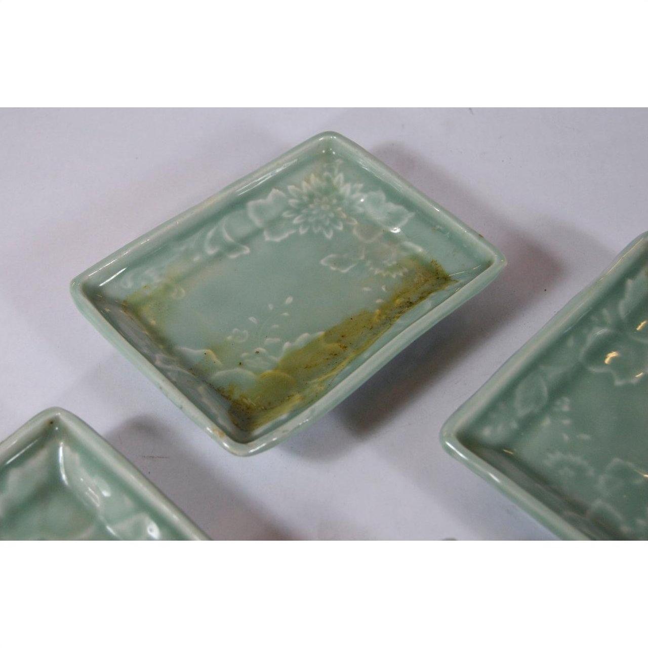 Light green ceramic rectangular dish with floral patterns and brownish discoloration, Japanese Celadon style.