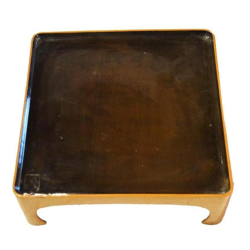 Glossy dark brown lacquered bamboo tea ceremony tray with lighter wood frame, close-up.