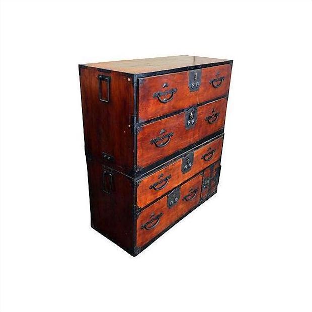 Brown Keyaki wood Japanese Isho-Dansu clothing chest with metal handles and multiple stacked drawers.