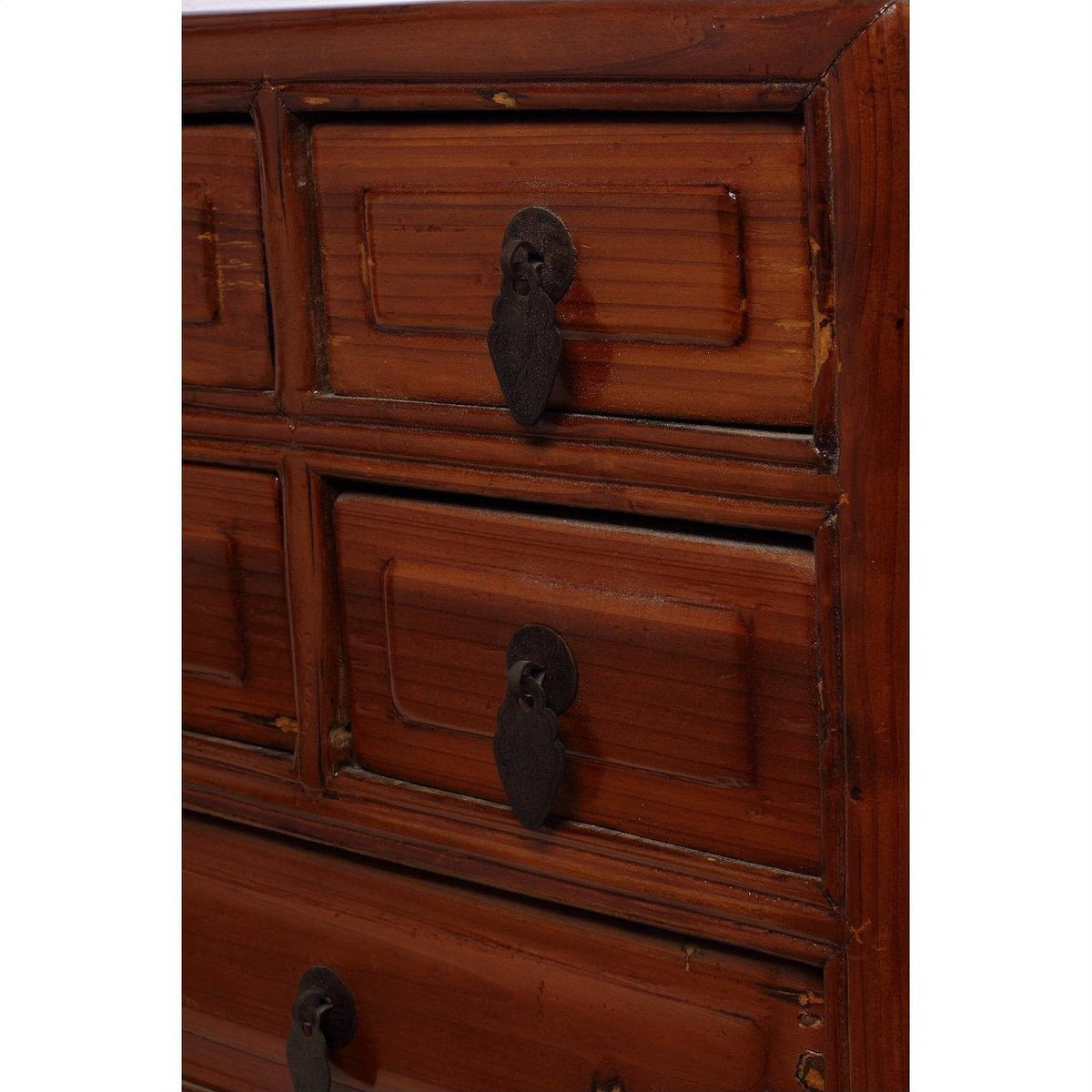 Close-up of vintage Chinese jewelry box with five drawers, dark metal handles, and ornate wood detailing.