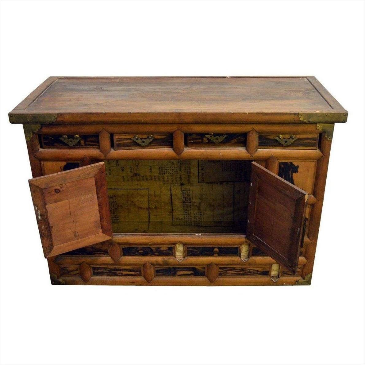 Dark wood Korean chest, 19th century, with butterfly brass hardware and two doors, visible aged wood texture inside.