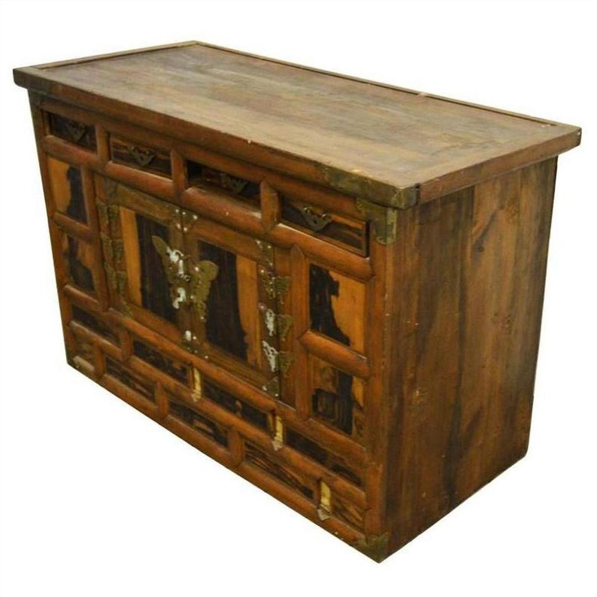 Brown wooden 19th-century Korean chest with butterfly brass hardware, angled on a white background.