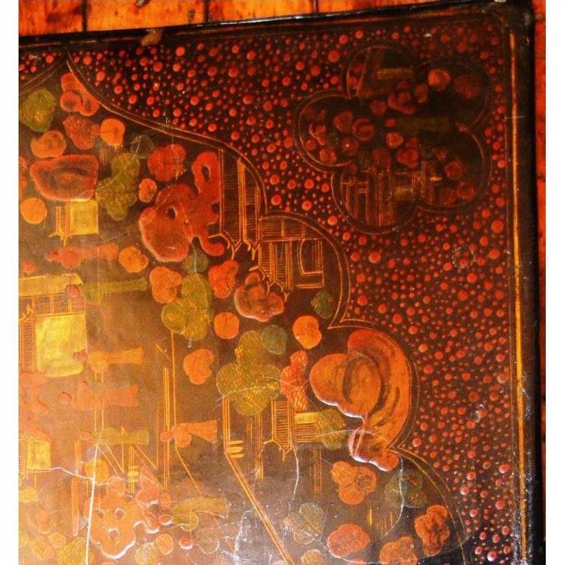 Close-up of abstract painting with red, green, and yellow patterns inspired by Lacquered Trunk on Stand.