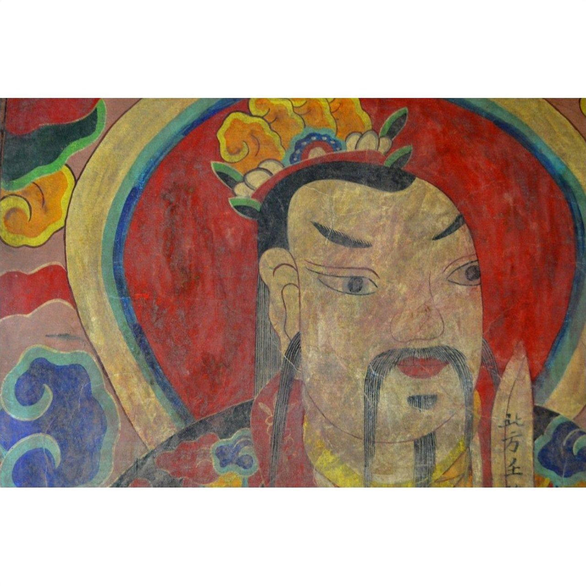 Red parchment painting close-up of a crowned, bearded Laotian man with mustache, ancient art style.