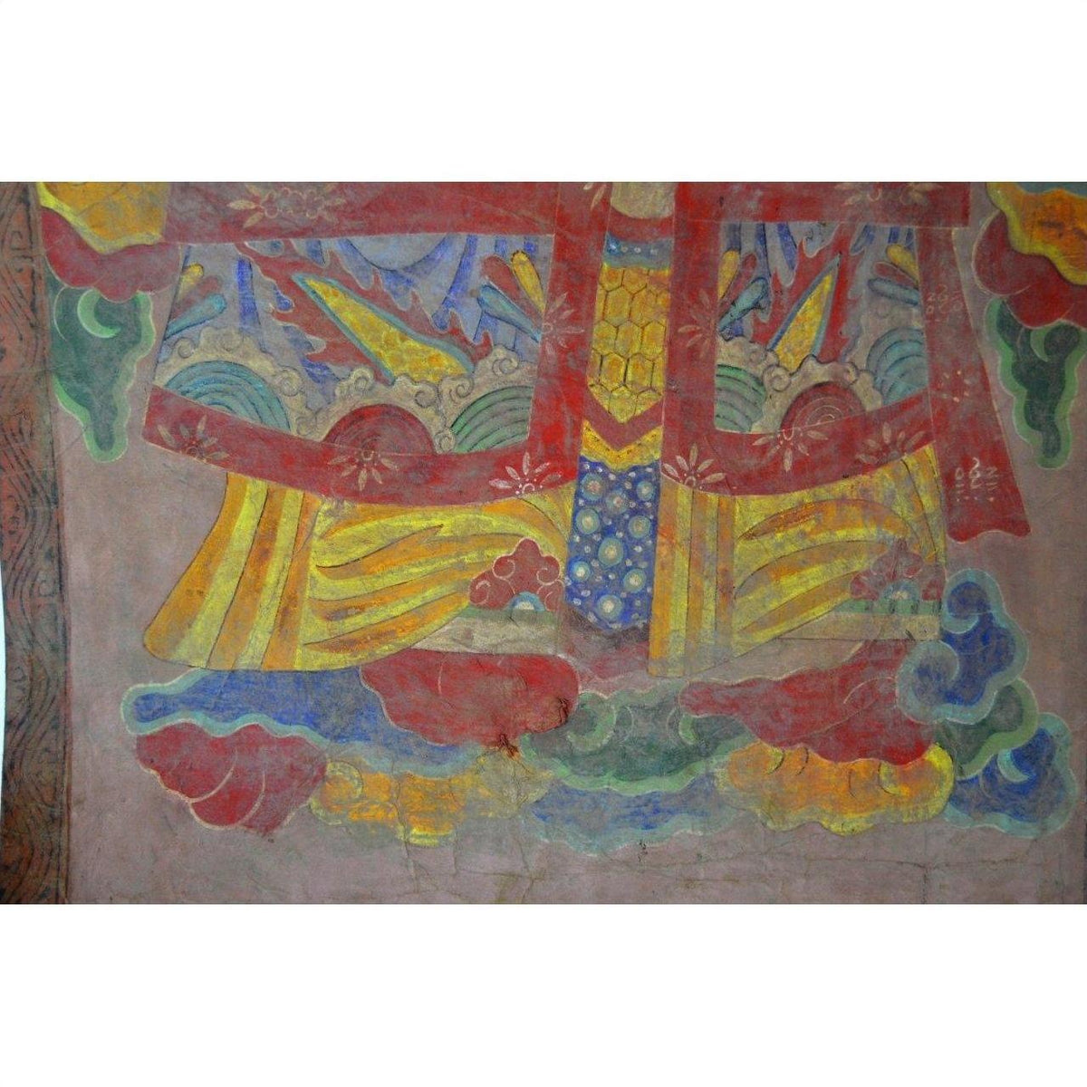 Multicolor parchment painting with red, yellow, green, and blue abstract fabric and cloud patterns.