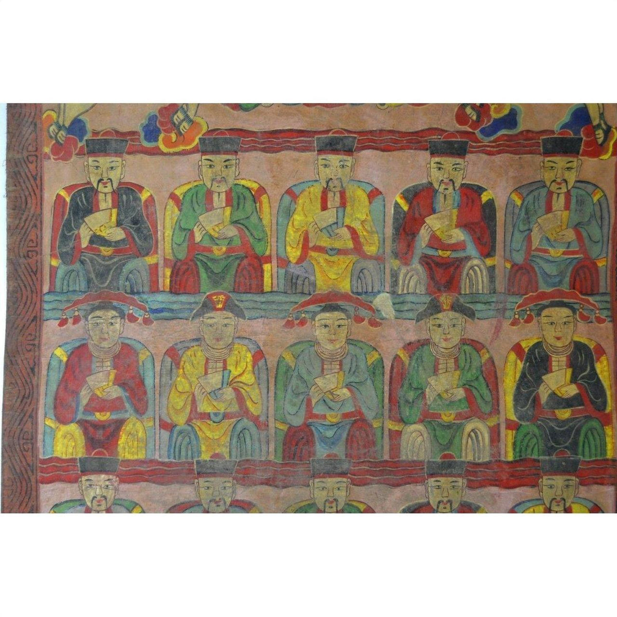 Multicolored parchment painting with three rows of robed, seated figures wearing hats on a patterned background.