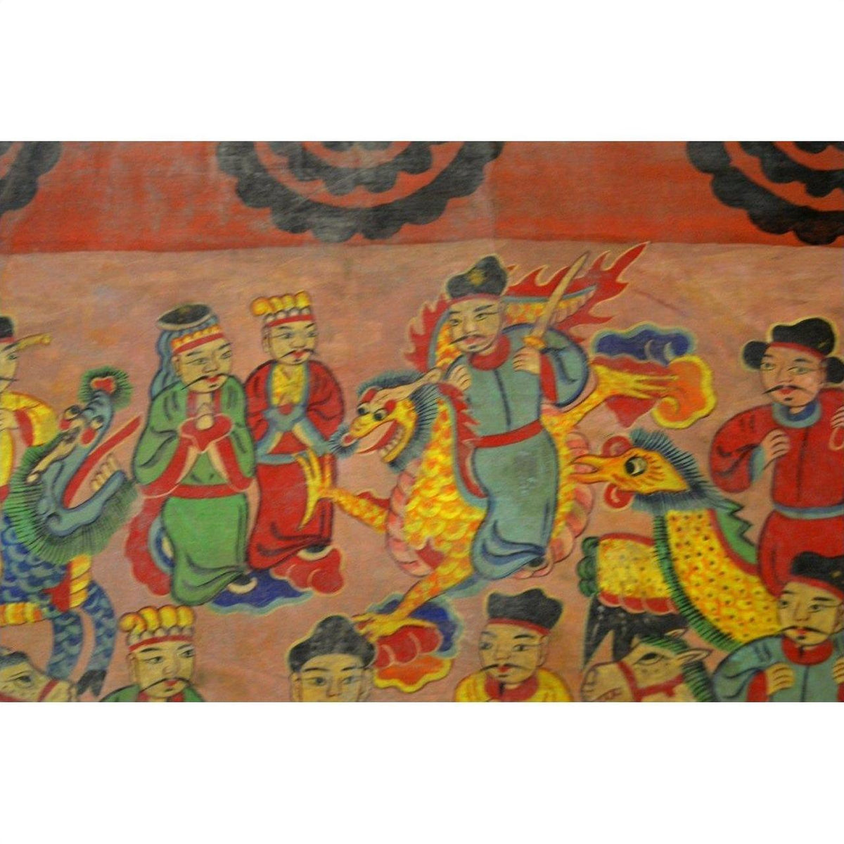 Red-orange parchment painting with robed figures and dragons, vivid background, traditional Laotian style.