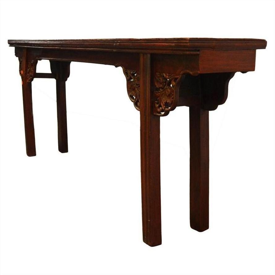 Brown antique elm wood altar table with ornate carvings and straight legs, displayed on a plain white background.