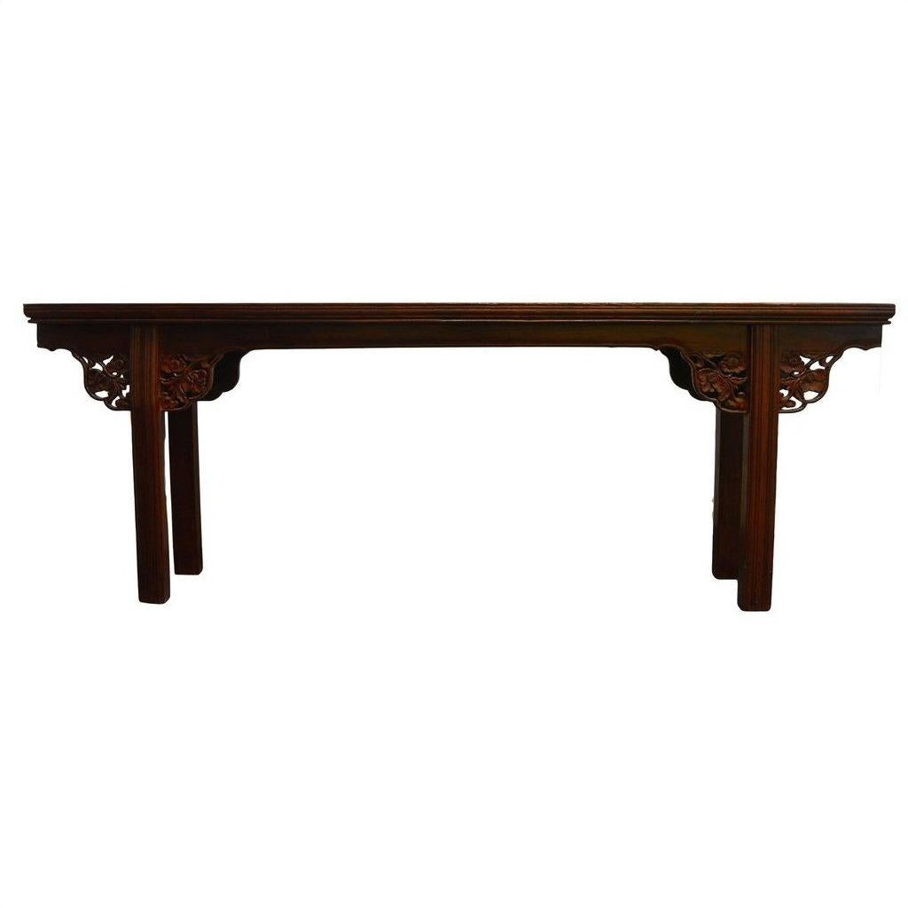 Dark wood altar table with ornate carved corners, straight legs, and stained finish, front view.